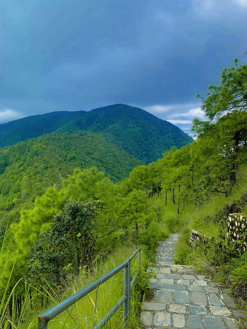  Champadevi Hill with lush greenery and mountains in the background